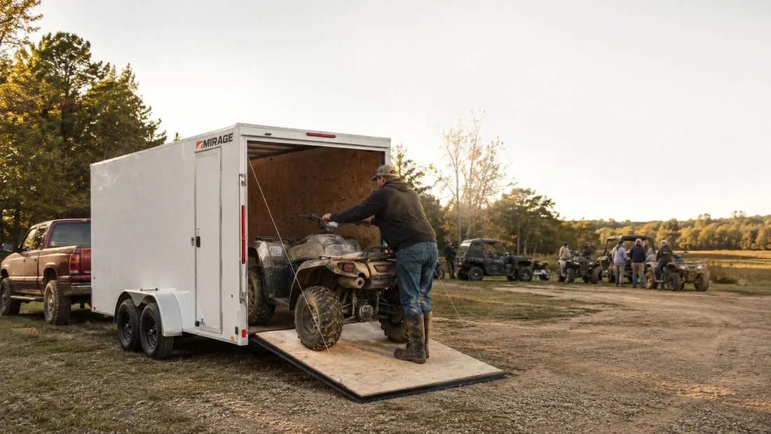 mirage-3 Loading lawn care equipment into a Mirage Equinox enclosed trailer